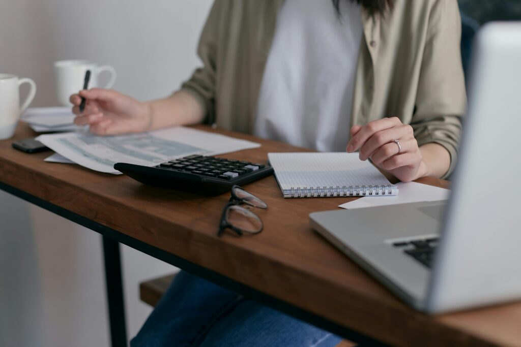 Woman at her desk doing financial planning.